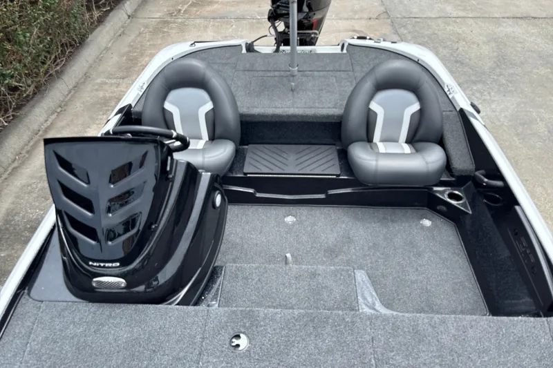 Slide: The Image of 2026 Nitro Z17 boat interior with dual gray seats and sleek design. - 16