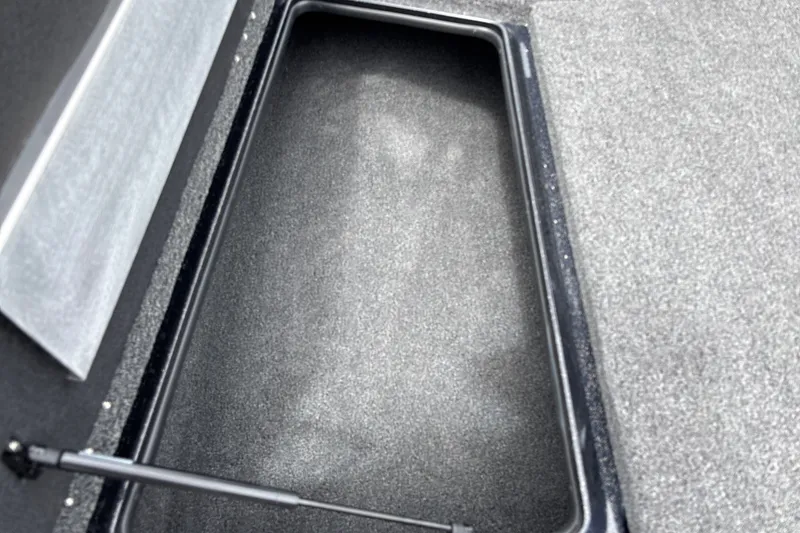 Slide: The Image of Storage compartment in 2026 Nitro Z17 boat, featuring a sleek, carpeted interior design. - 18