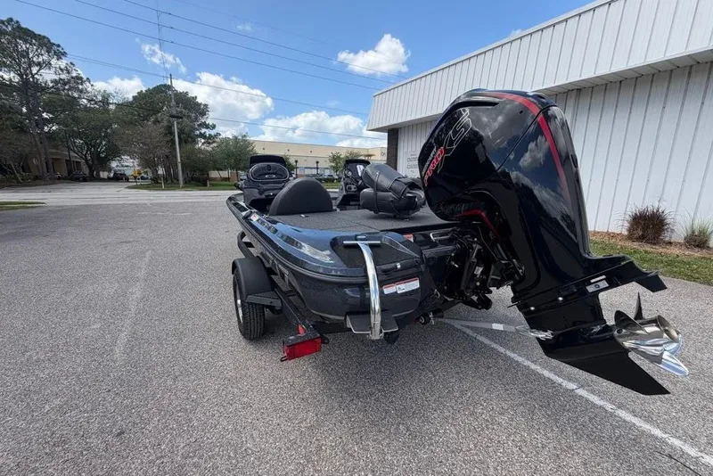 Slide: The Image of 2026 Nitro Z17 boat with powerful outboard motor in a parking lot. - 96