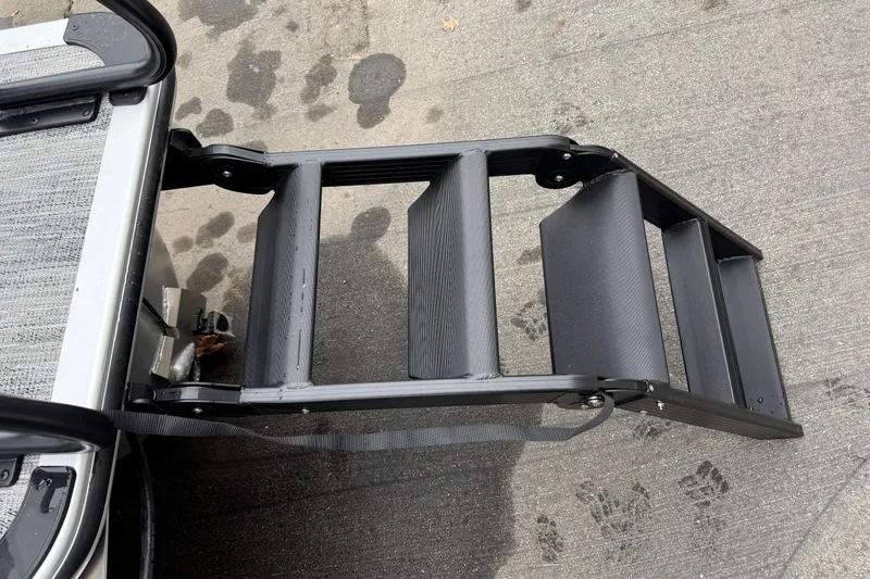 Slide: The Image of Bentley Pontoons Legacy 240 Navigator Ext 2026 boat ladder on concrete surface. - 4