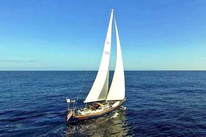 The Image of Sailboat Hans Christian Christina 1992 cruising on open sea under clear blue sky. - 0