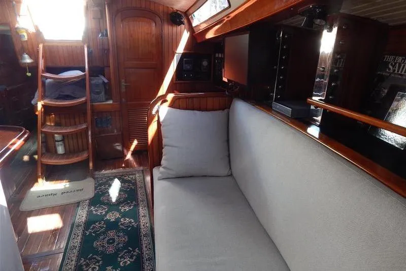 Slide: The Image of Interior of 1992 Hans Christian Christina yacht with wooden finish and cozy seating. - 10