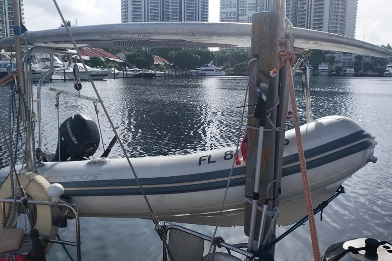 Slide: The Image of Sailboat "Christina" by Hans Christian, 1992, with dinghy and Mercury motor in marina. - 14