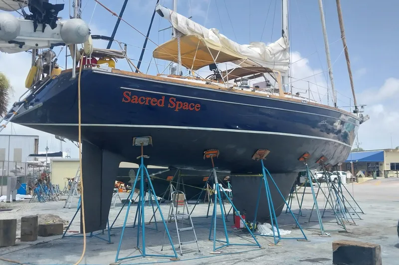 Slide: The Image of Sailboat "Sacred Space" on stands, Hans Christian Christina 1992 model, in a boatyard. - 20