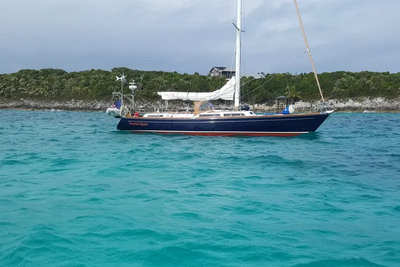 Slide: The Image of Sailboat "Sacred Space" on turquoise waters, Hans Christian Christina 1992 model. - 21