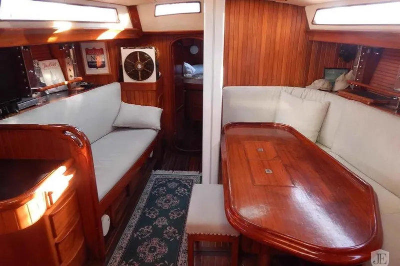 Slide: The Image of Interior of 1992 Hans Christian Christina yacht with wooden furnishings and cozy seating area. - 3