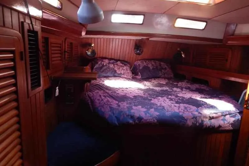 Slide: The Image of Cozy cabin interior of 1992 Hans Christian Christina sailboat with floral bedding. - 5