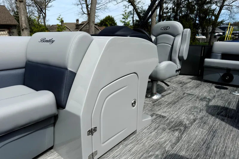 Slide: The Image of 2026 Bentley Pontoons Legacy 220 Cruise XL interior with luxurious seating and modern design. - 11