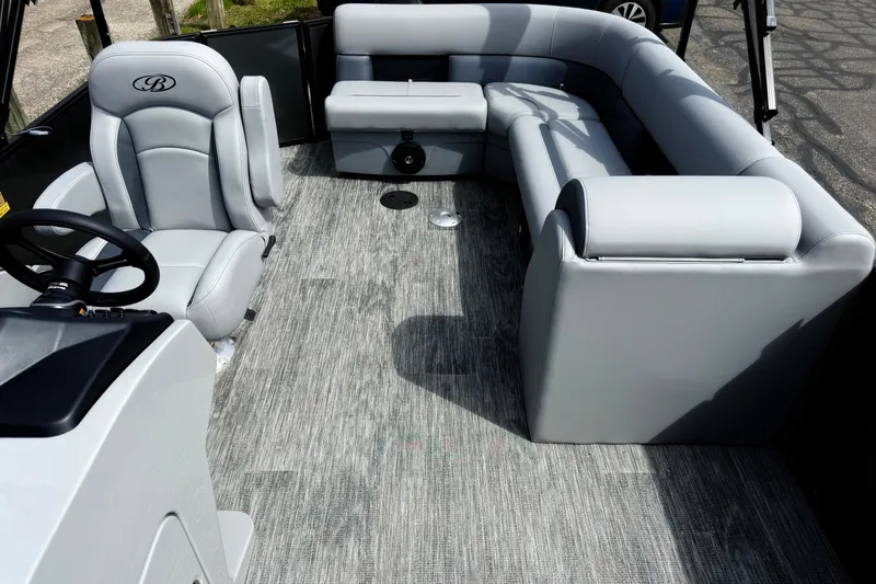 Slide: The Image of 2026 Bentley Pontoons Legacy 220 Cruise XL interior with luxurious gray seating and modern design. - 12