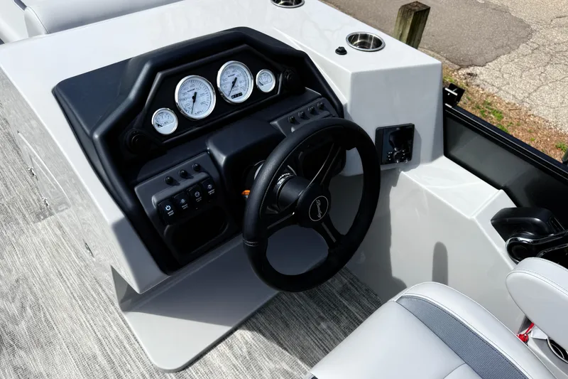 Slide: The Image of Steering console of 2026 Bentley Pontoons Legacy 220 Cruise XL with gauges and controls. - 14