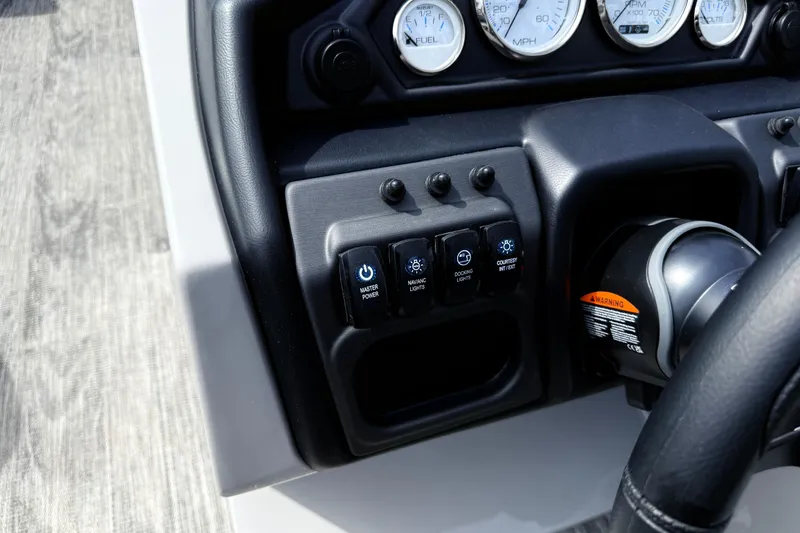 Slide: The Image of Control panel of 2026 Bentley Pontoons Legacy 220 Cruise XL with gauges and switches. - 15
