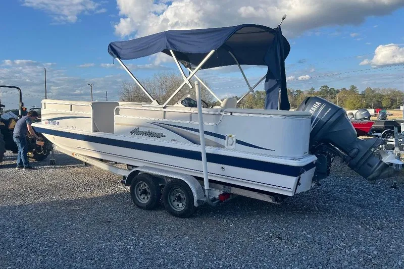 Slide: The Image of 2005 Hurricane FunDeck 226 boat with canopy and Yamaha outboard motor on trailer. - 4