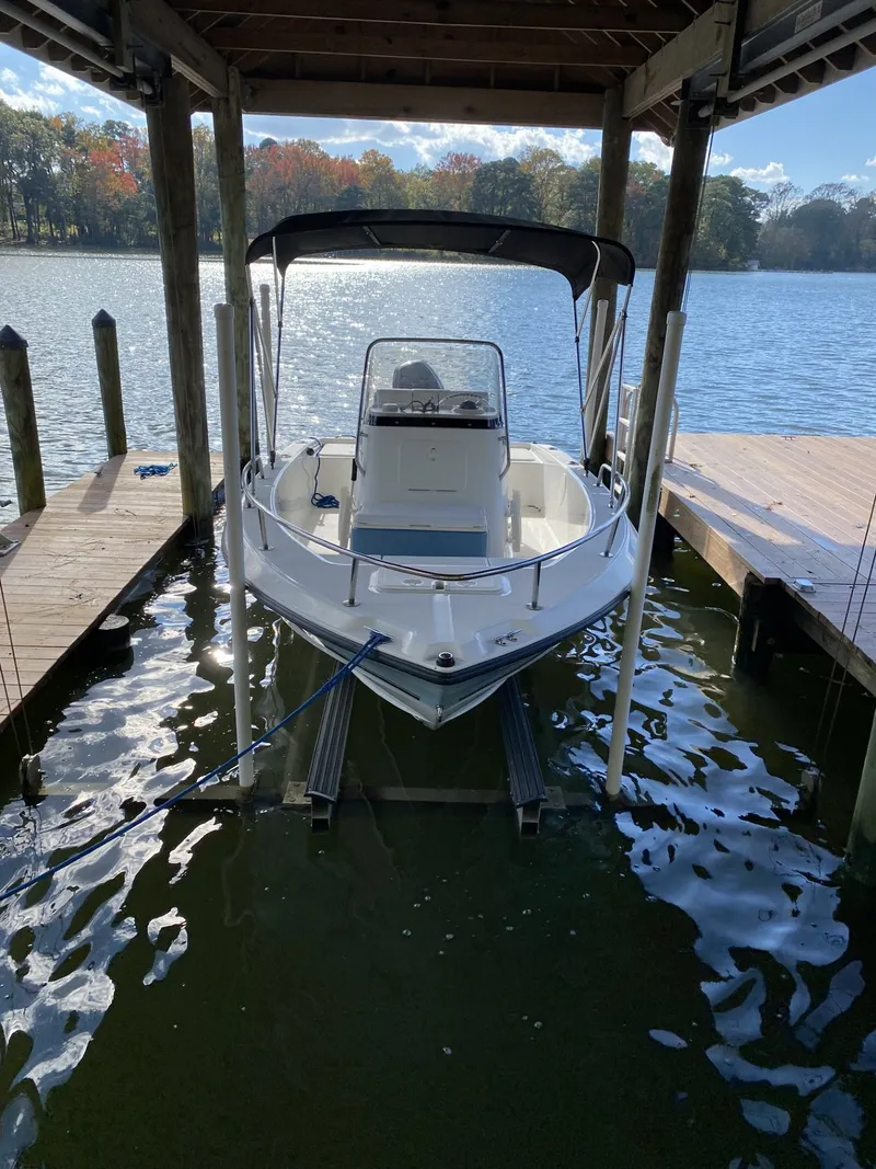 Slide: The Image of 2006 Century 17 CC boat in a covered dock. - 4