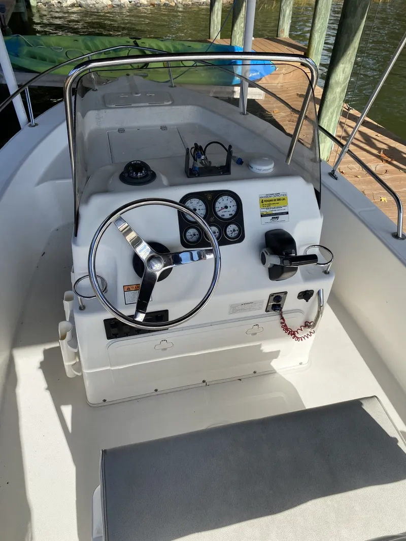Slide: The Image of Steering console of a 2006 Century 17 CC boat at dock. - 6