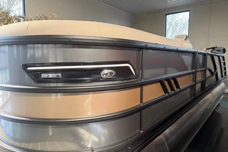 Slide: The Image of 2026 Bentley Pontoons Elite 223 Admiral, sleek design in showroom setting. - 3