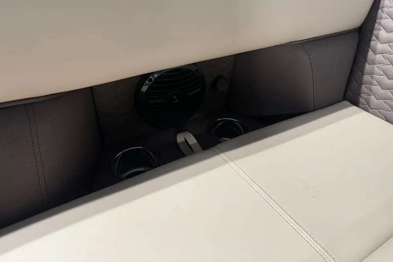 Slide: The Image of 2026 Bentley Pontoons Elite 223 Admiral interior with speaker and cup holders. - 6