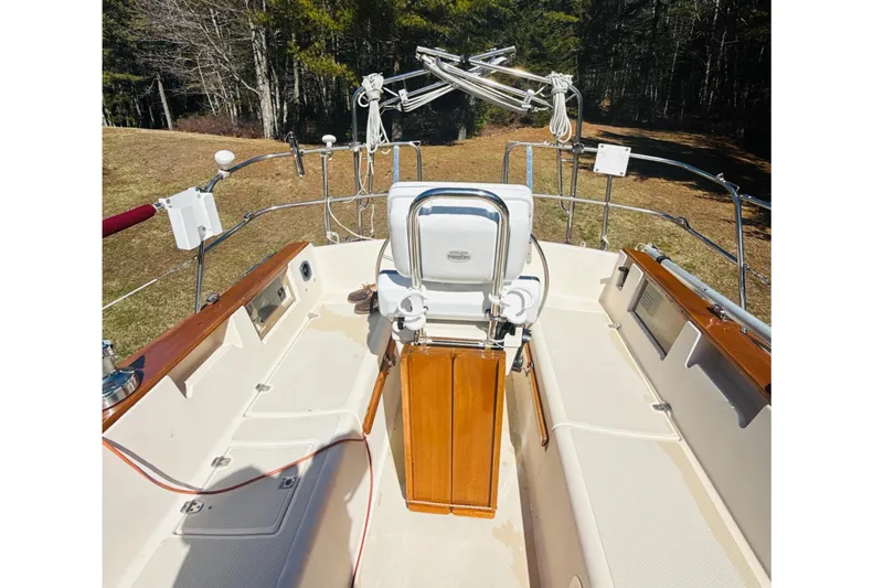 Slide: The Image of Cockpit of 1995 Island Packet 37 sailboat with compass and steering wheel. - 15