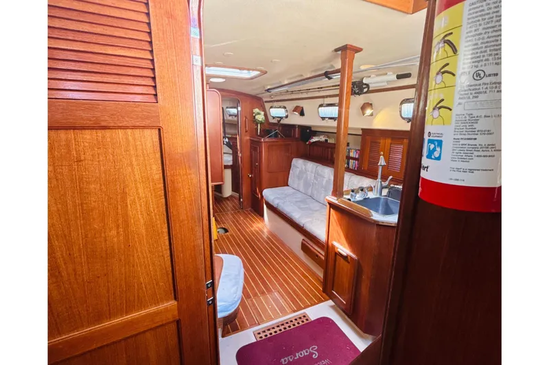 Slide: The Image of Interior cabin of a 1995 Island Packet 37 sailboat with wooden furnishings. - 29