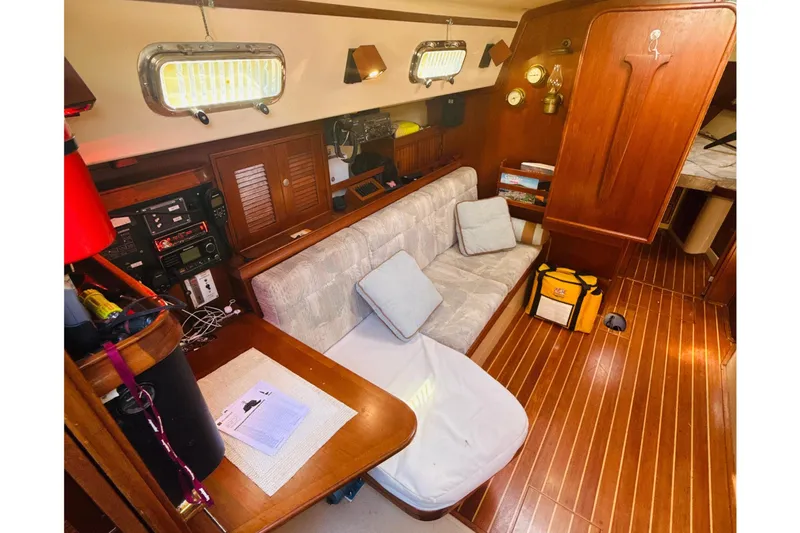 Slide: The Image of Interior cabin of a 1995 Island Packet 37 sailboat, featuring a cozy sleeping area. - 30