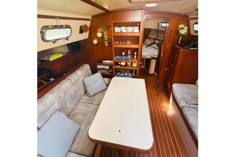 Slide: The Image of Interior of 1995 Island Packet 37 sailboat with navigation station and safety equipment. - 33