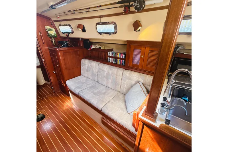 Slide: The Image of 1995 Island Packet 37 yacht kitchen with a three-burner stove and oven. - 39