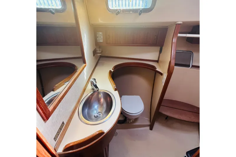 Slide: The Image of Interior of 1995 Island Packet 37 sailboat with wooden finish and cozy cabin. - 44