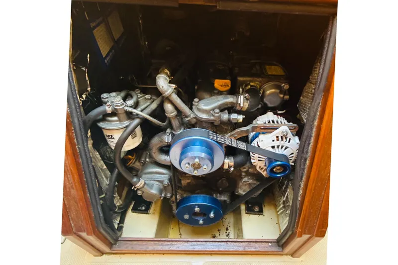Slide: The Image of Cozy cabin interior of a 1995 Island Packet 37 sailboat with cushioned berth. - 51