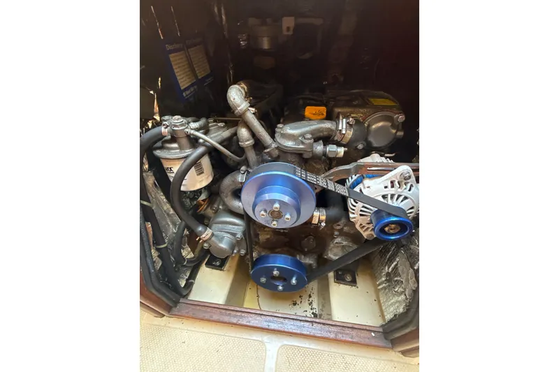 Slide: The Image of Electrical panel on a 1995 Island Packet 37 sailboat, featuring control switches and dials. - 52