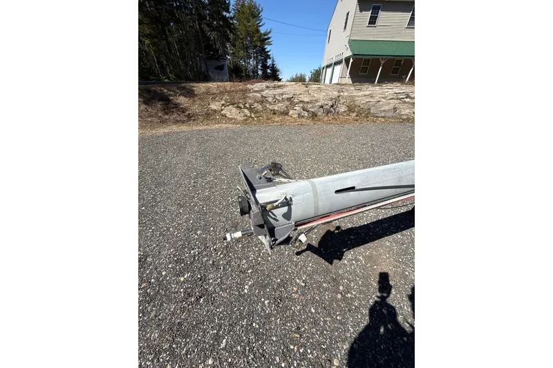 Slide: The Image of Engine compartment of a 1995 Island Packet 37 sailboat, featuring visible belts and components. - 54