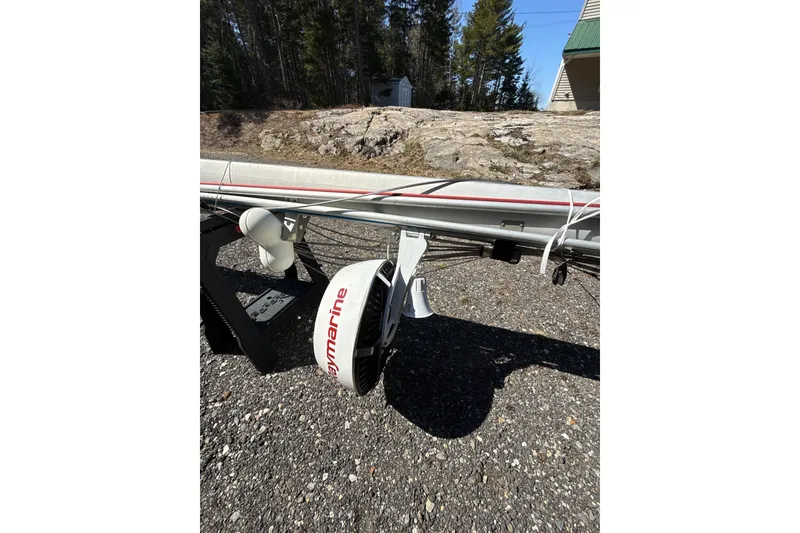 Slide: The Image of Mast of a 1995 Island Packet 37 sailboat on a trailer, parked outdoors. - 55
