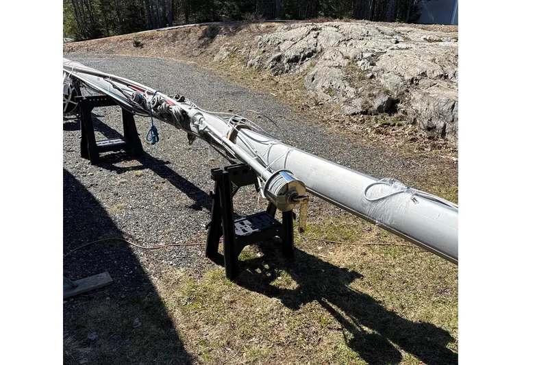 Slide: The Image of Mast of a 1995 Island Packet 37 sailboat on gravel driveway. - 56