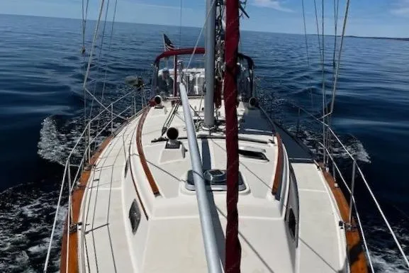 Slide: The Image of Sailing on a 1995 Island Packet 37 yacht in calm ocean waters. - 8