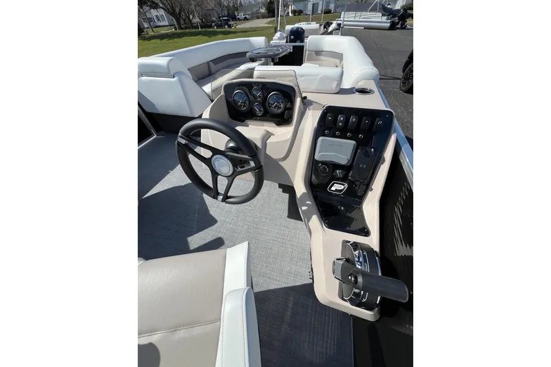 Slide: The Image of 2024 Princecraft Vectra 25 RL boat dashboard with steering wheel and controls. - 8