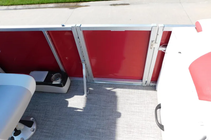 Slide: The Image of 2023 Tahoe Pontoon 2385 LTZ Quad Lounger interior with red paneling and seating. - 44