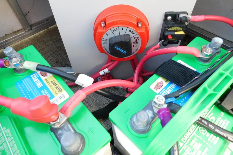 Slide: The Image of Battery setup in a 2023 Tahoe Pontoon 2385 LTZ Quad Lounger with Perko switch. - 19