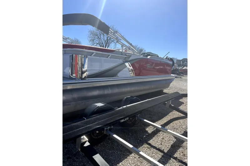 Slide: The Image of 2023 Tahoe Pontoon 2385 Cascade Quad Lounger on trailer under clear blue sky. - 3
