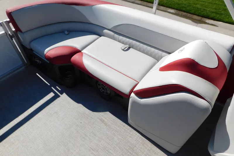 Slide: The Image of Luxurious seating on 2023 Tahoe Pontoon 2385 LTZ Quad Lounger, featuring red and white upholstery. - 17