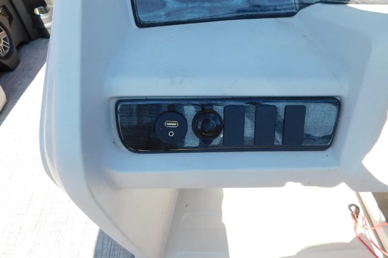 Slide: The Image of Dashboard of 2023 Tahoe Pontoon 2385 LTZ Quad Lounger with USB port and controls. - 41