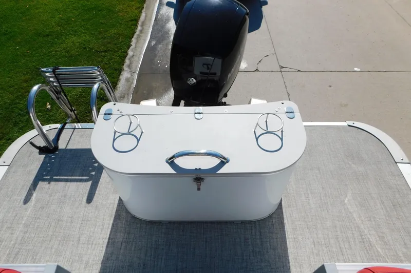 Slide: The Image of 2023 Tahoe Pontoon 2385 LTZ Quad Lounger rear view with motor and ladder. - 9