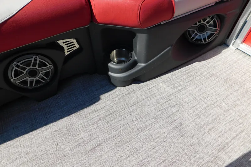 Slide: The Image of 2023 Tahoe Pontoon 2385 LTZ Quad Lounger interior with speakers and cup holder. - 38