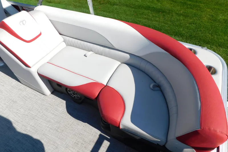 Slide: The Image of Luxurious seating on 2023 Tahoe Pontoon 2385 LTZ Quad Lounger, featuring red and white upholstery. - 13