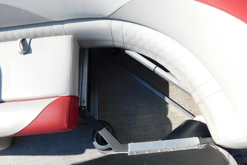 Slide: The Image of 2023 Tahoe Pontoon 2385 LTZ Quad Lounger interior seating detail, featuring red and white upholstery. - 35