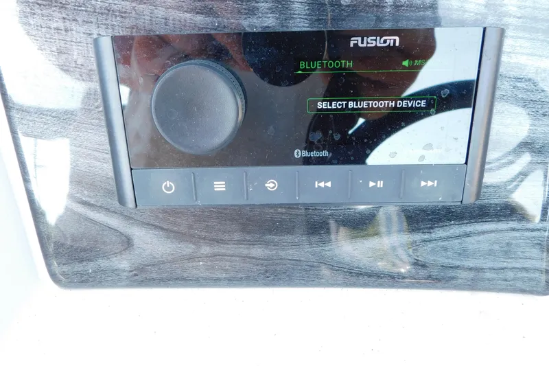 Slide: The Image of Fusion Bluetooth audio system on 2023 Tahoe Pontoon 2385 LTZ Quad Lounger. - 25