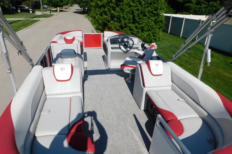 Slide: The Image of 2023 Tahoe Pontoon 2385 LTZ Quad Lounger with red and white seating on a sunny day. - 8
