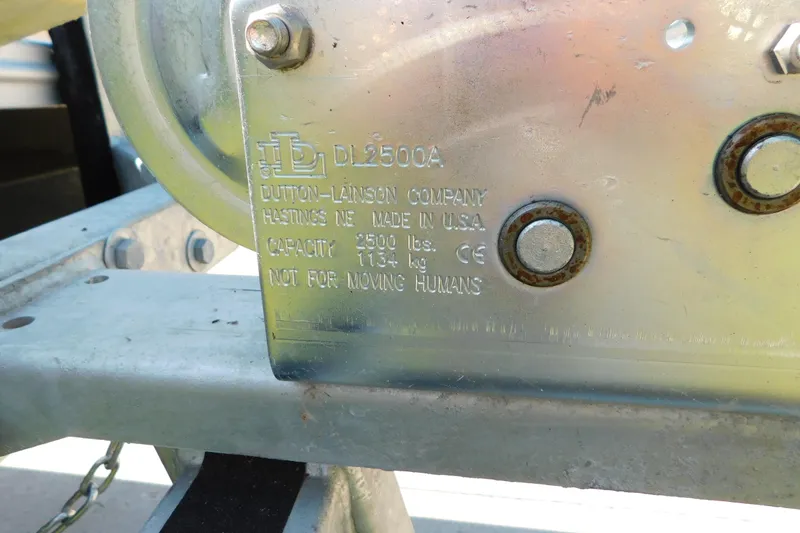 Slide: The Image of Close-up of Dutton-Lainson DL2500A winch on 2023 Tahoe Pontoon 2385 LTZ Quad Lounger. - 52