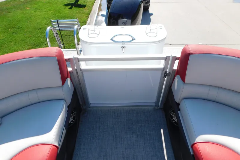 Slide: The Image of 2023 Tahoe Pontoon 2385 LTZ Quad Lounger interior with red and gray seating. - 12