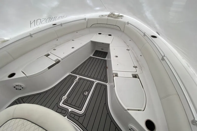 Slide: The Image of 2020 Sportsman Open 282 Center Console boat interior with sleek seating and storage compartments. - 10