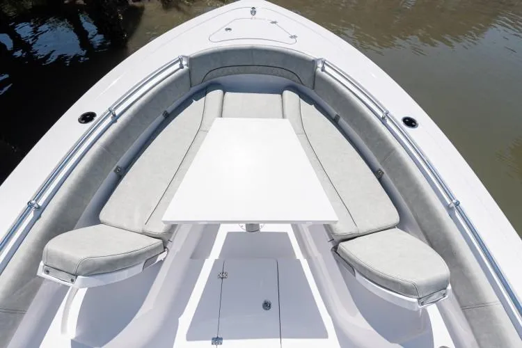 Slide: The Image of Manufacturer Provided Image: 2020 Sportsman Open 282 Center Console boat with cushioned seating and table. - 18