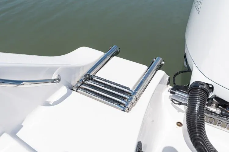 Slide: The Image of Manufacturer Provided Image: 2020 Sportsman Open 282 Center Console boat with a stainless steel swim ladder. - 29