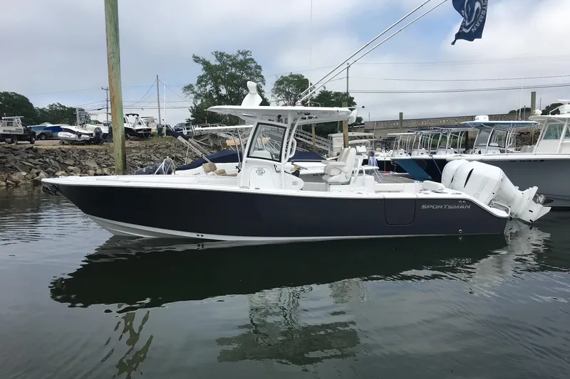 Slide: The Image of 2020 Sportsman Open 282 Center Console boat docked in marina. - 3